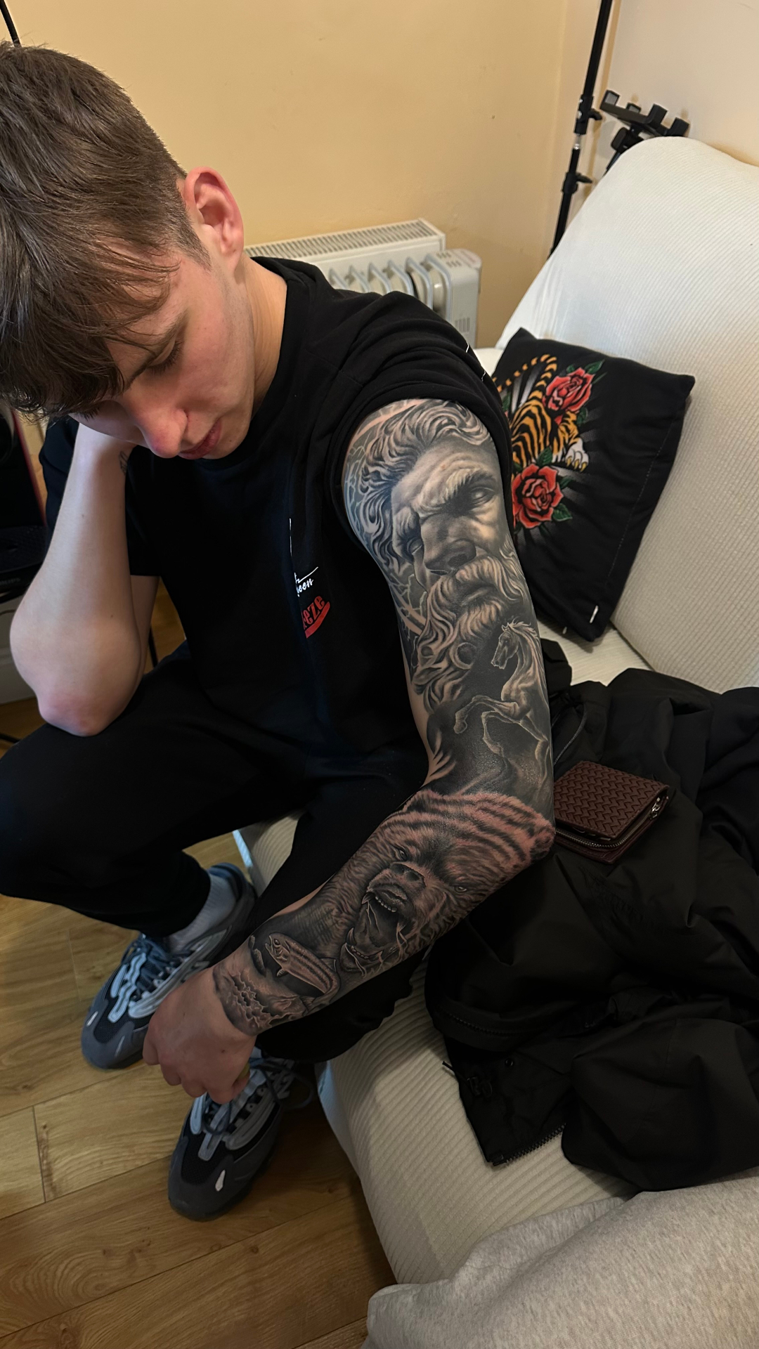 Full sleeve black and grey tattoo of Zeus, horse and roaring bear
